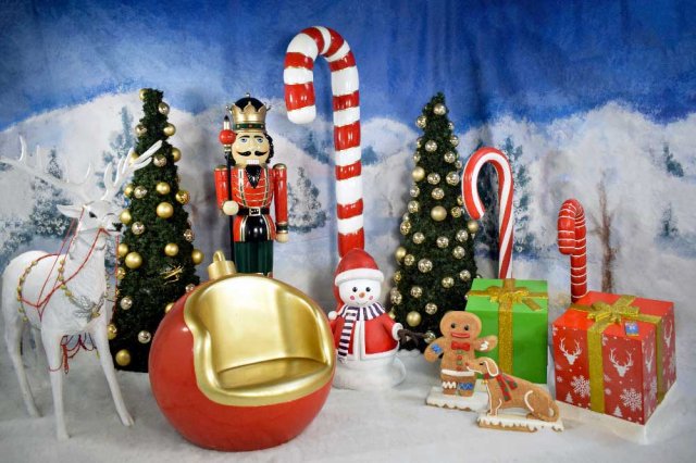 A variety of Christmas Props including a reindeer prop, dressed christmas tree, nutcracker, candy cane and gingerbread man