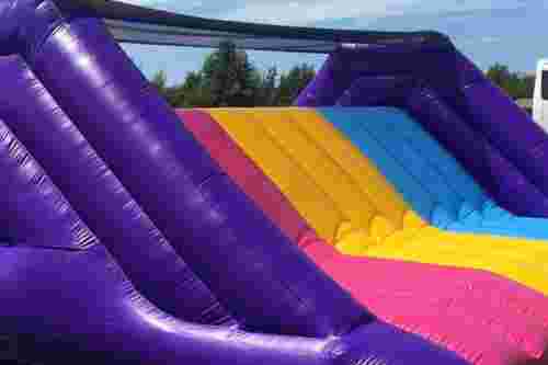 Up and over inflatable slide